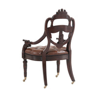 Armchair back view showing detailed woodwork.