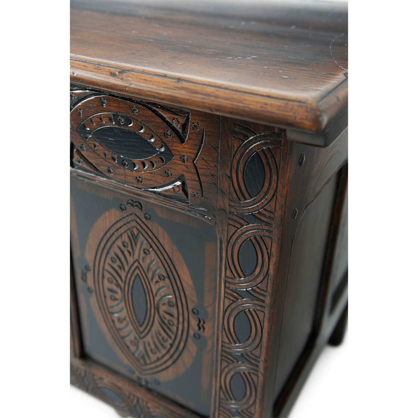 Close-up of English blanket chest corner carvings.