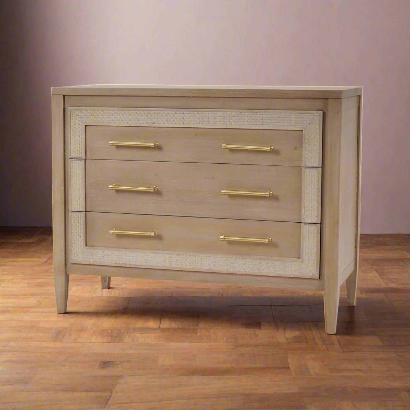 Chest of drawers in room setting, light wooden floor.