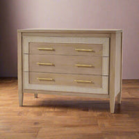 Chest of drawers in room setting, light wooden floor.