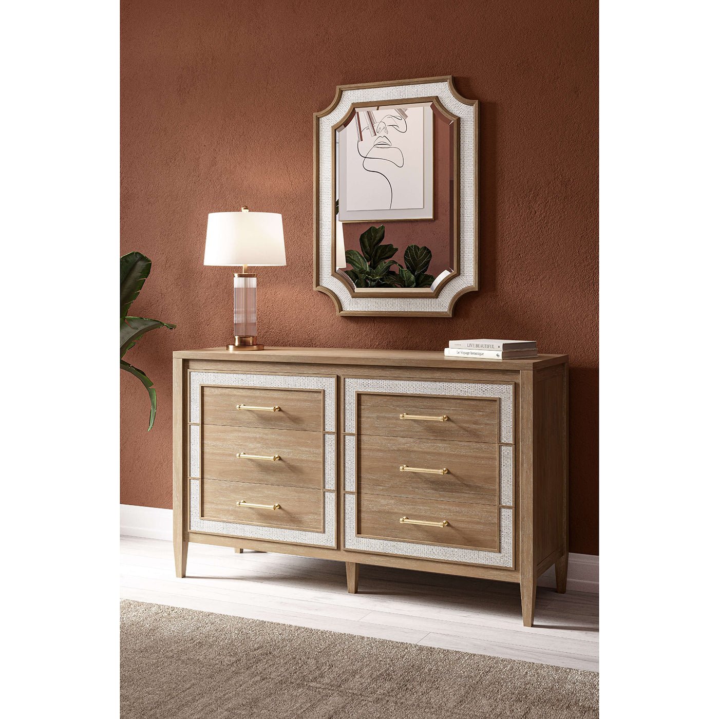 Modern dresser in room with mirror and lamp above.