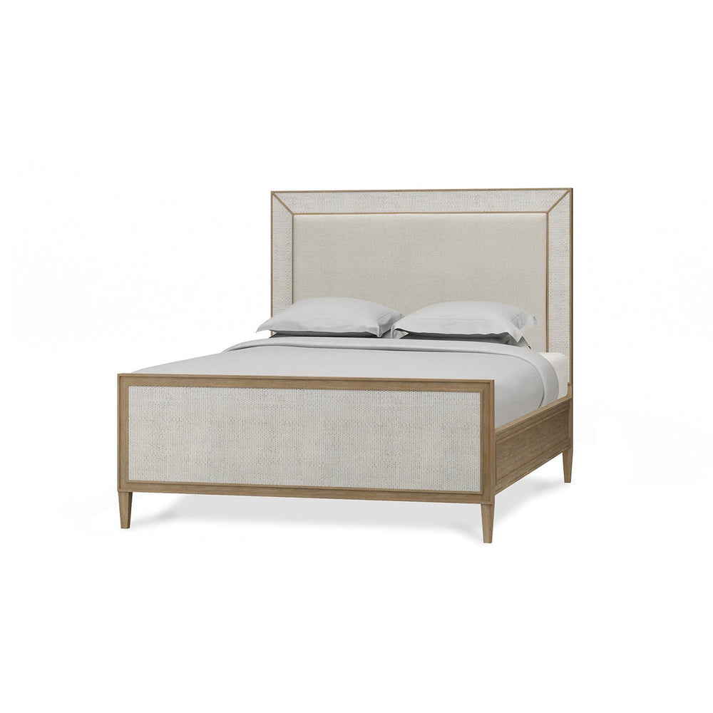 Modern queen bed angled view with bedding.