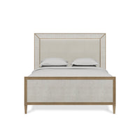 Front view of modern queen bed with pillows.