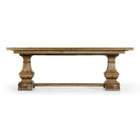 Side view of wooden dining table showcasing pedestal legs.