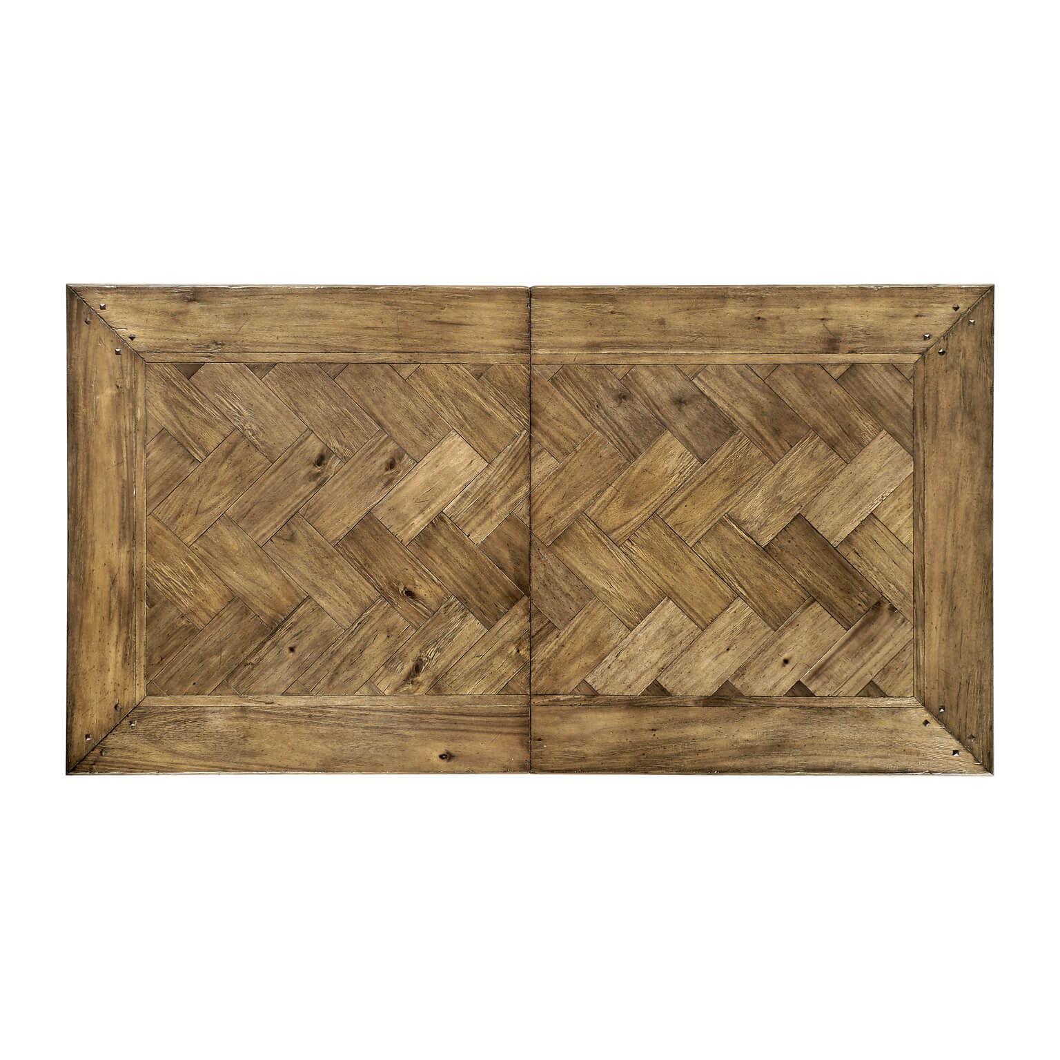 Top view of wooden dining table with herringbone pattern.
