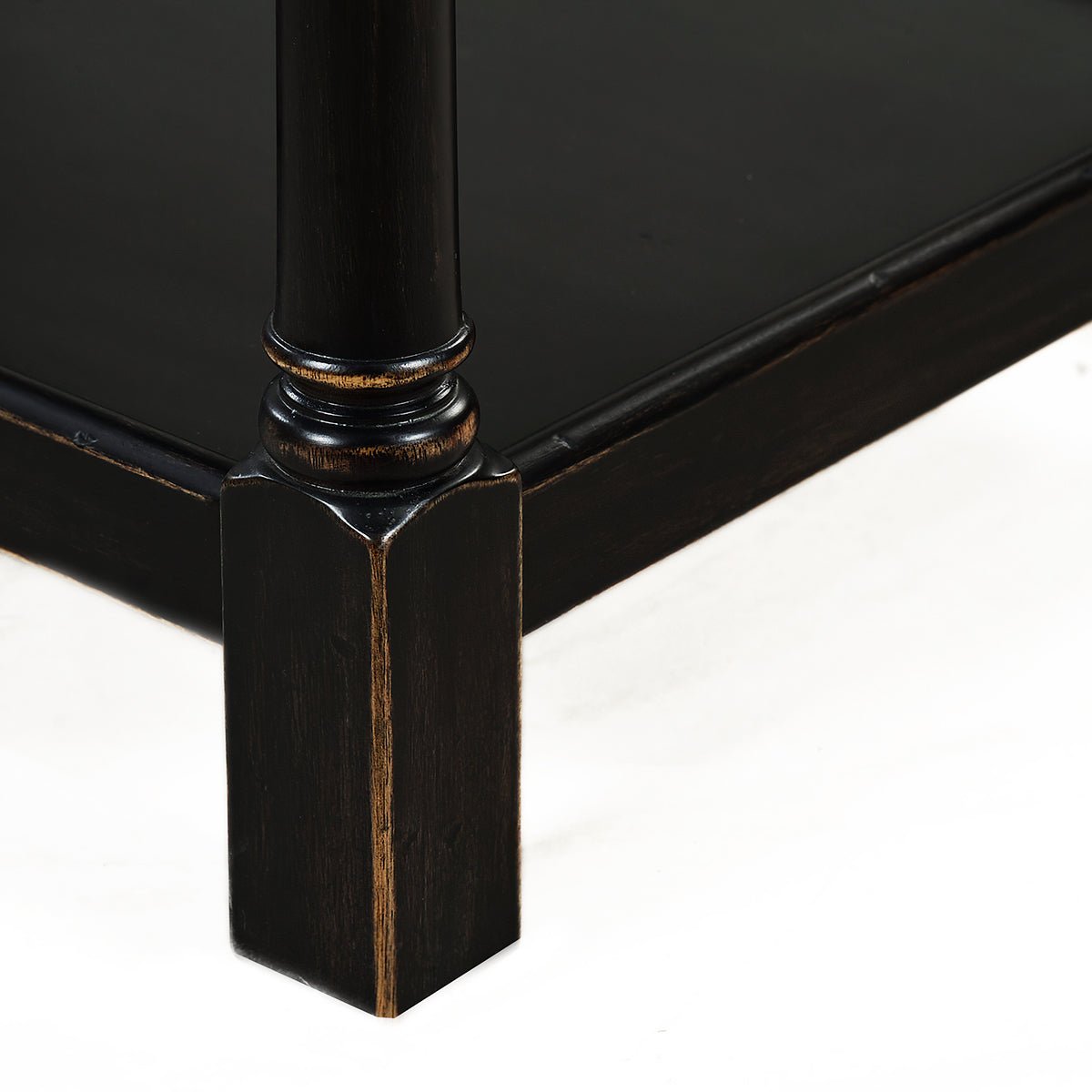End table leg showcasing intricate woodwork and craftsmanship.