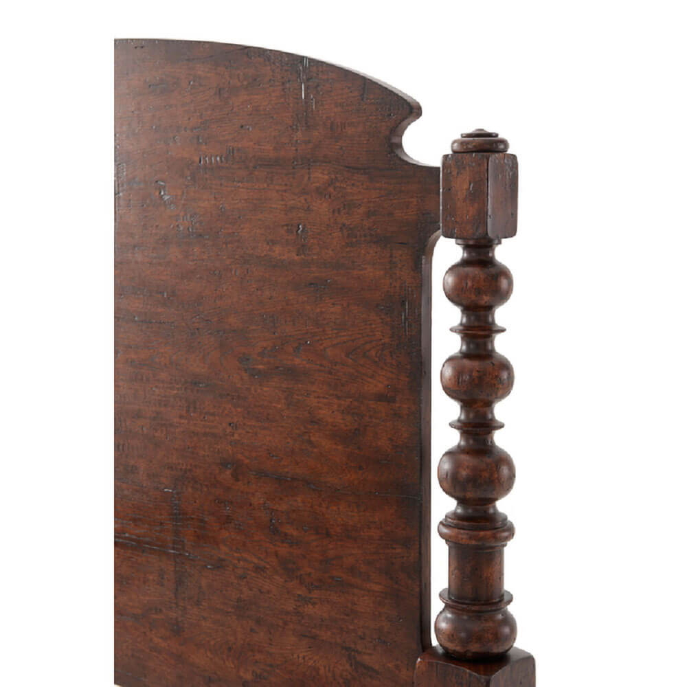 Close-up of side post detail, dark wood king bed.