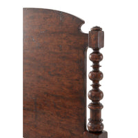 Close-up of side post detail, dark wood king bed.