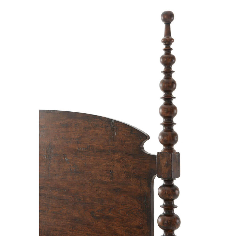 Close-up of bed post detail, dark wood king bed.