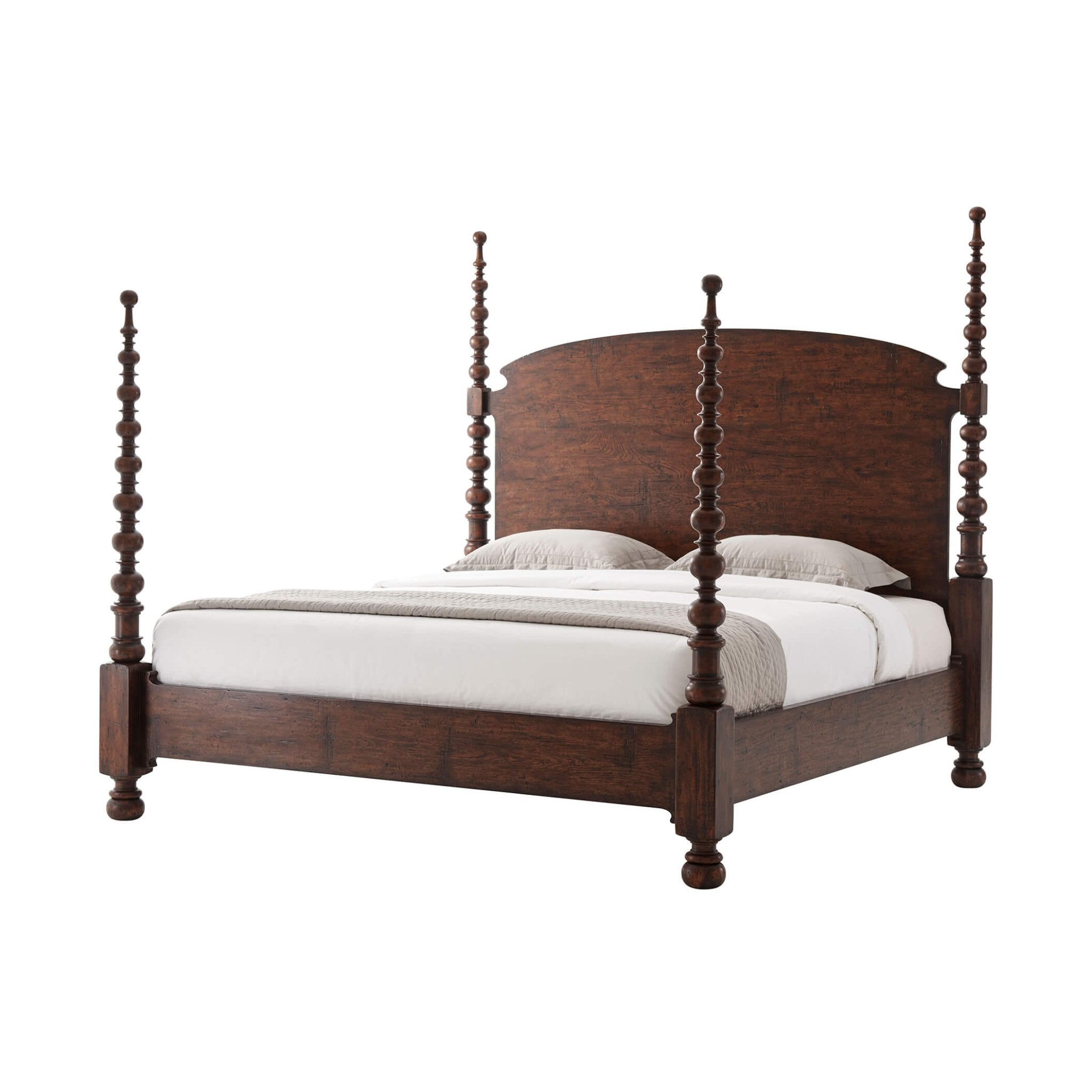 Dark wood four-poster king bed with white bedding.