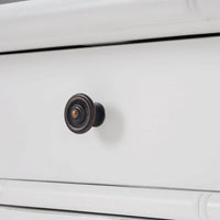 White end table close-up of drawer knob design.