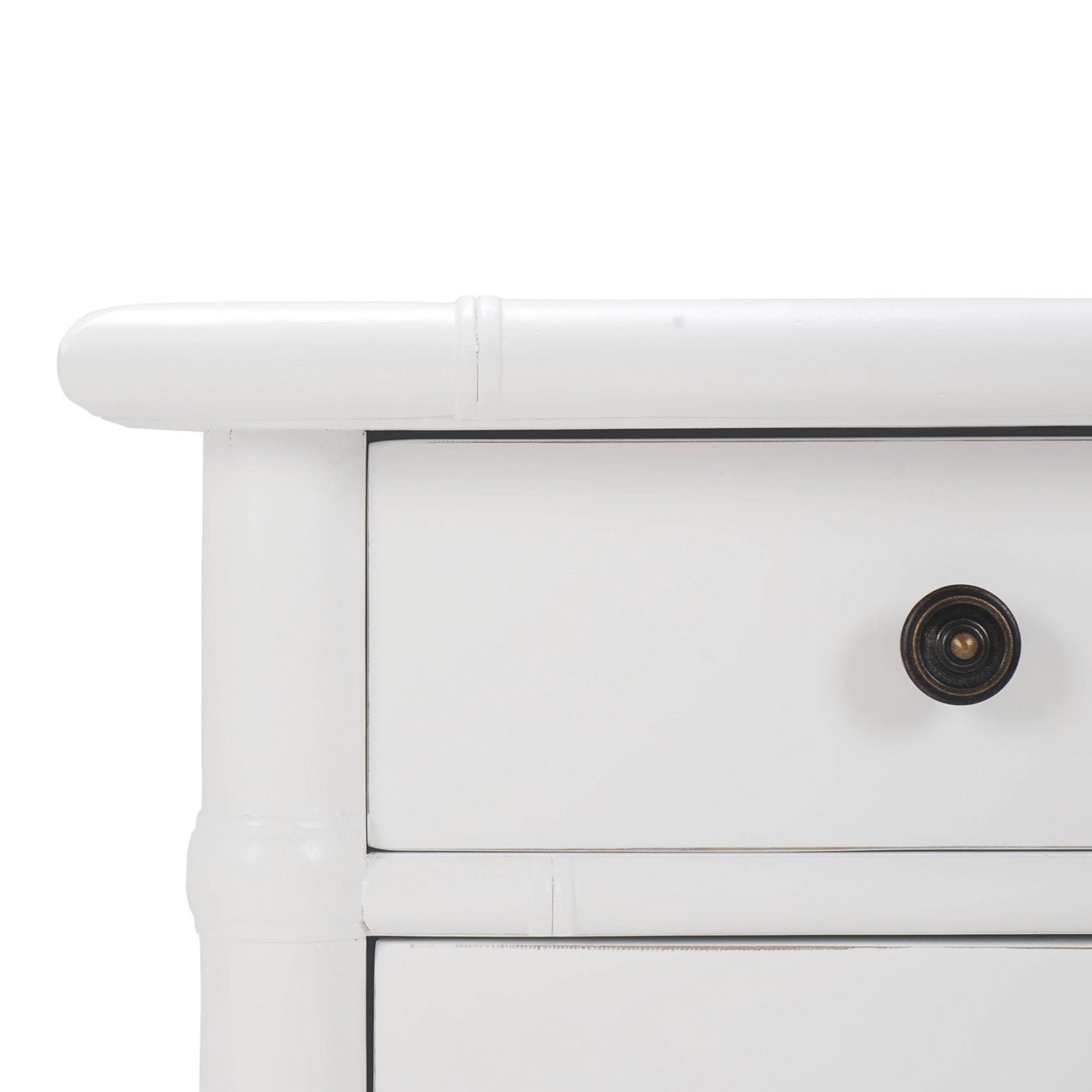 White end table close-up, drawer corner and knob detail.