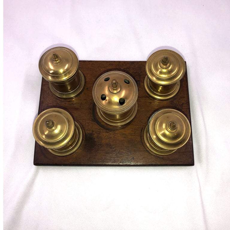 Top view of brass English desk set inkwell.