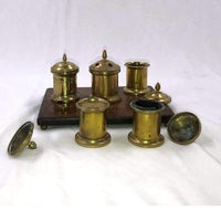 Disassembled English desk set inkwell with open lids.