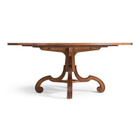 Profile of oak dining table's pedestal and curved legs.