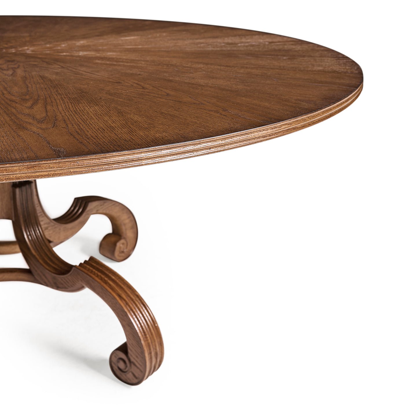 Perspective of oak dining table with curved pedestal legs.