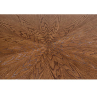 Close-up of oak dining table's intricate wood grain design.