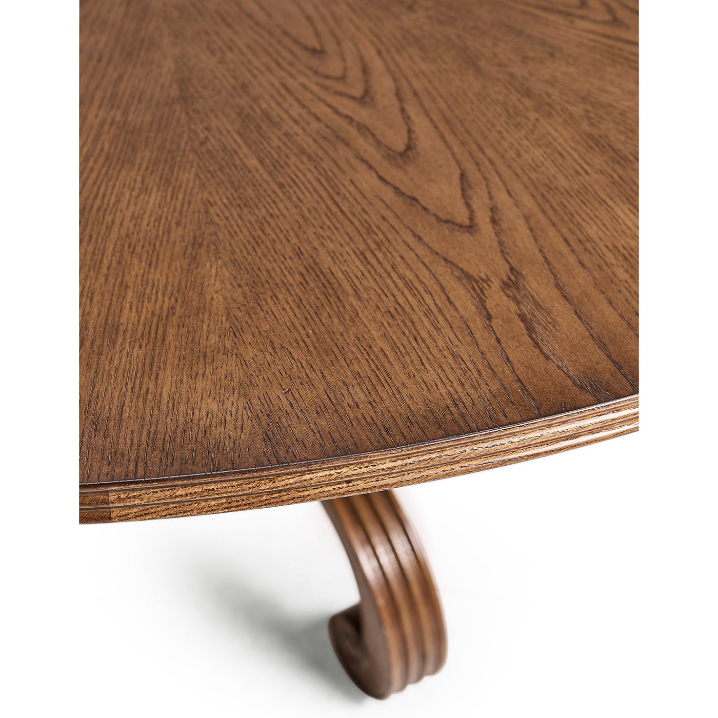 Edge detail of oak dining table with elegant wood pattern.