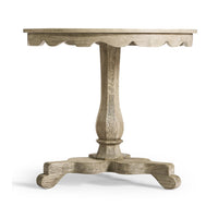Side view of round end table showcasing scalloped edges.