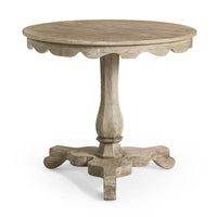 Rustic round end table with carved base and pedestal.