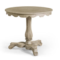 Grayed oak round end table with decorative edges.