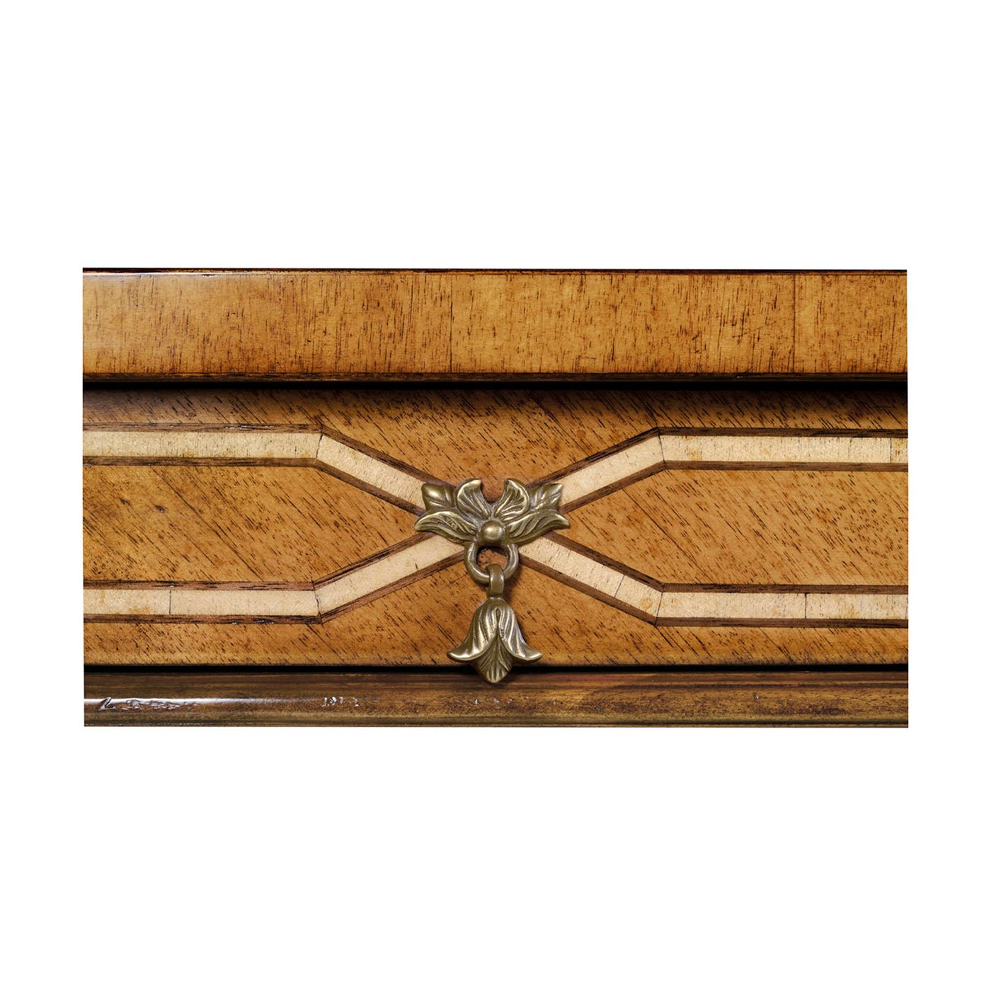 Close-up, table handle and decorative metalwork detail.