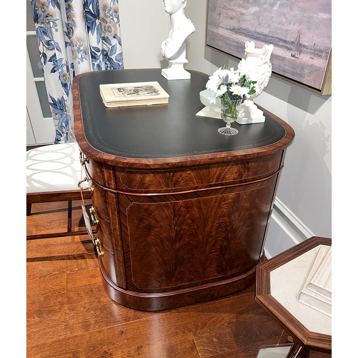 English leather top desk, side view, stylish wood finish.