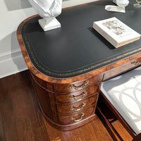 English leather top desk, top corner view, decorative detailing.