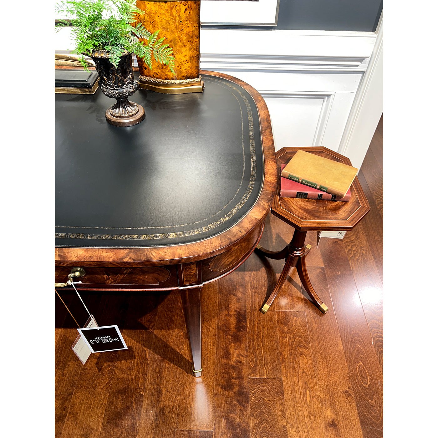 Close-up of writing table corner with decor, room background.