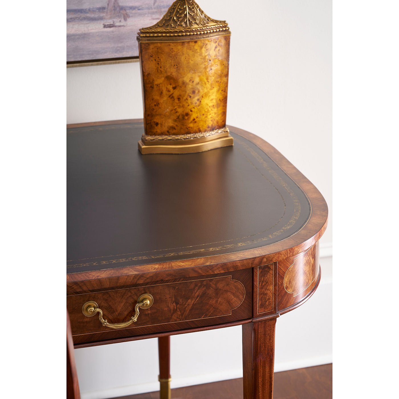 Close-up view of leather table top with lamp decor.