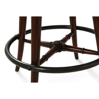 Footrest and leg detail on swivel bar stool.