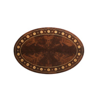 Top view of oval mahogany side table surface.