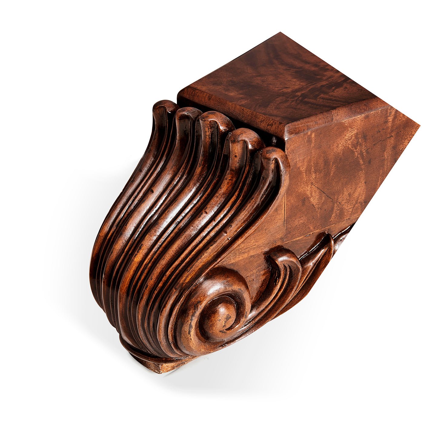 Carved mahogany foot detail of poker table, intricate design.