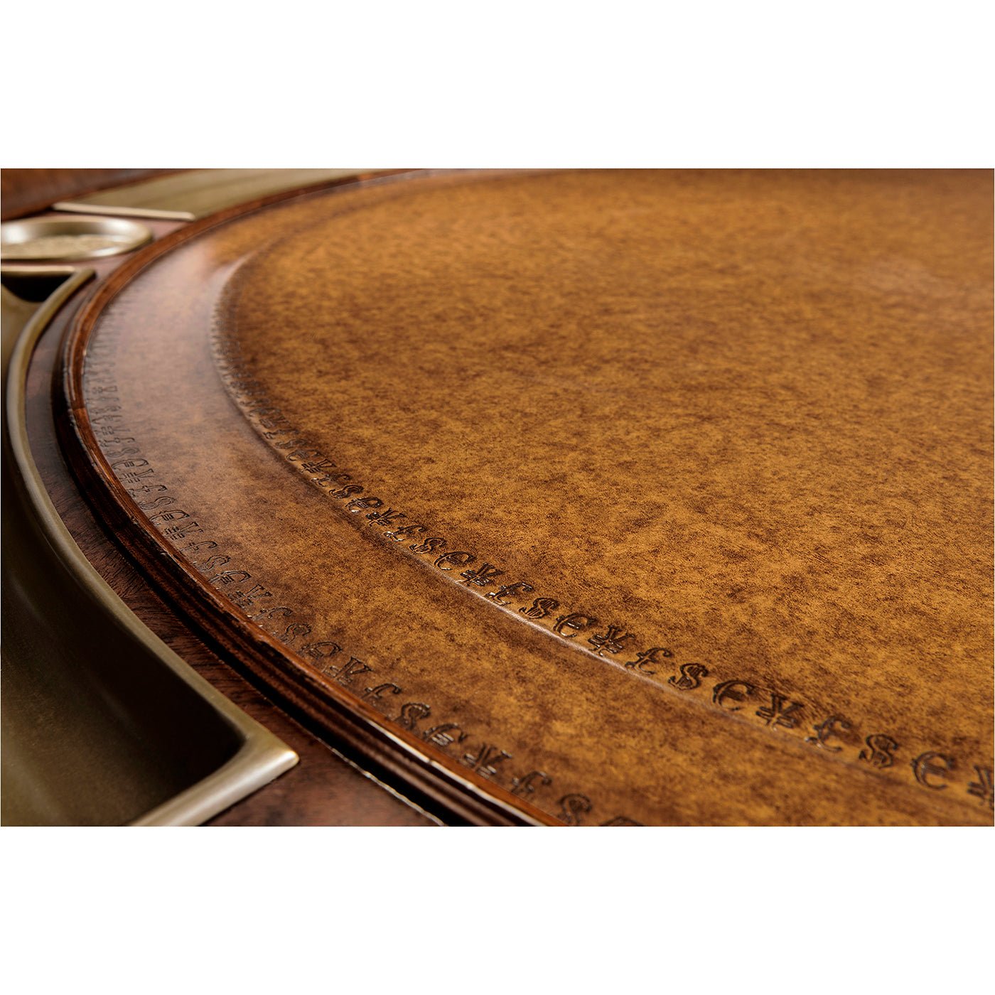 Detail view of poker table surface, intricate leather pattern.