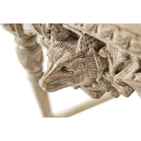 Side view of animal carving on console table.