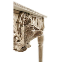 Detailed animal carving, console table close-up.