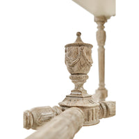 Center decor carving on console table crossbars.