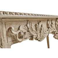 Ornate leaf carvings on console table detail.