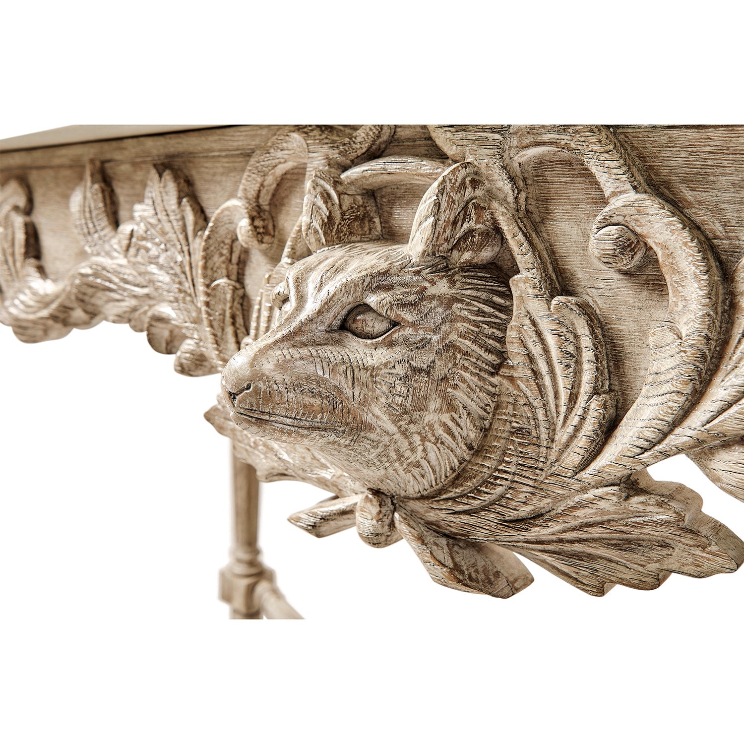 Close-up of animal carving on console table.