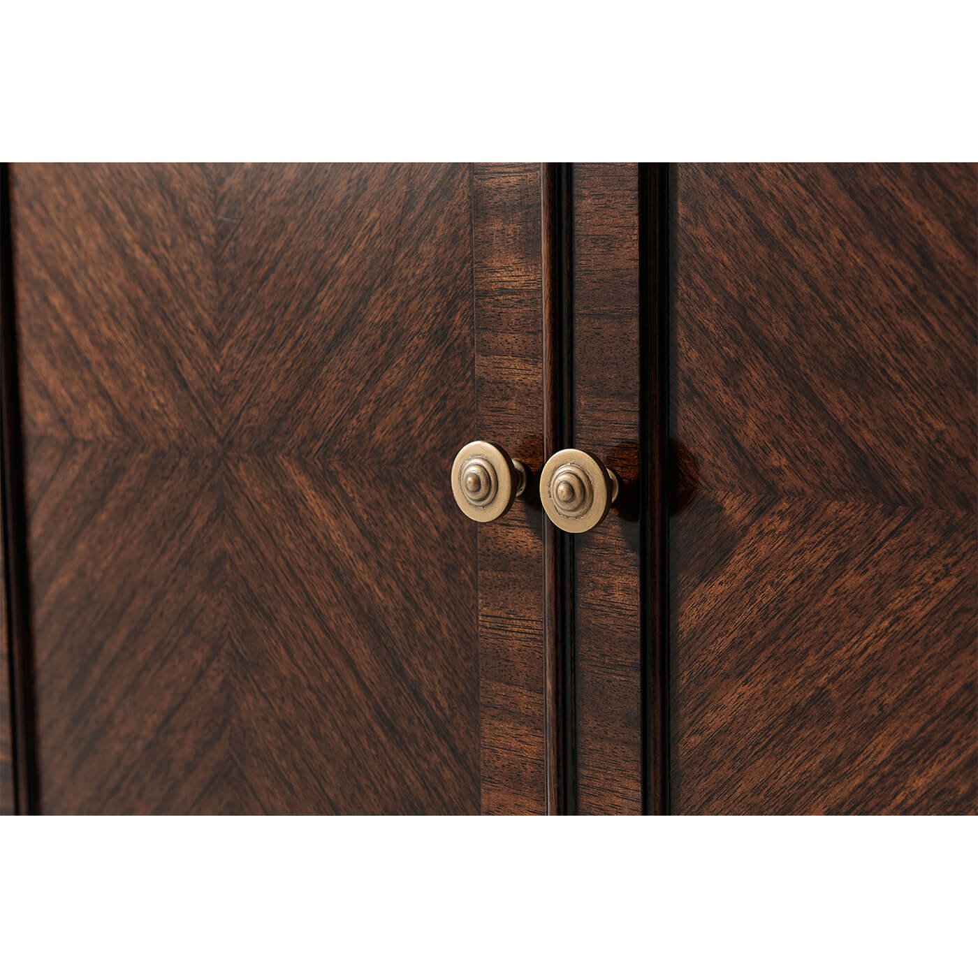 Close-up of breakfront credenza knobs and wood texture.