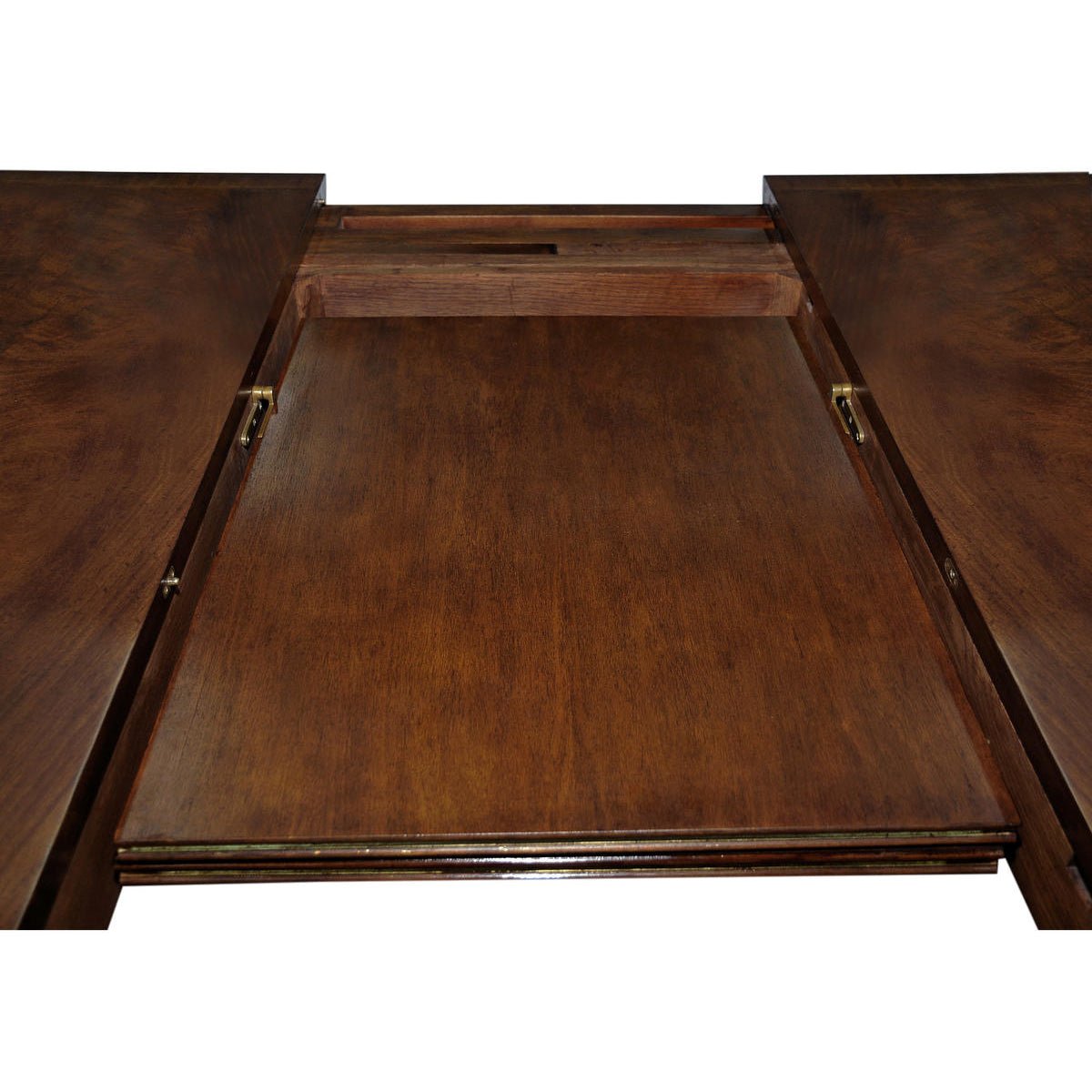 Extension mechanism of mahogany dining table in close-up.