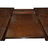 Extension mechanism of mahogany dining table in close-up.