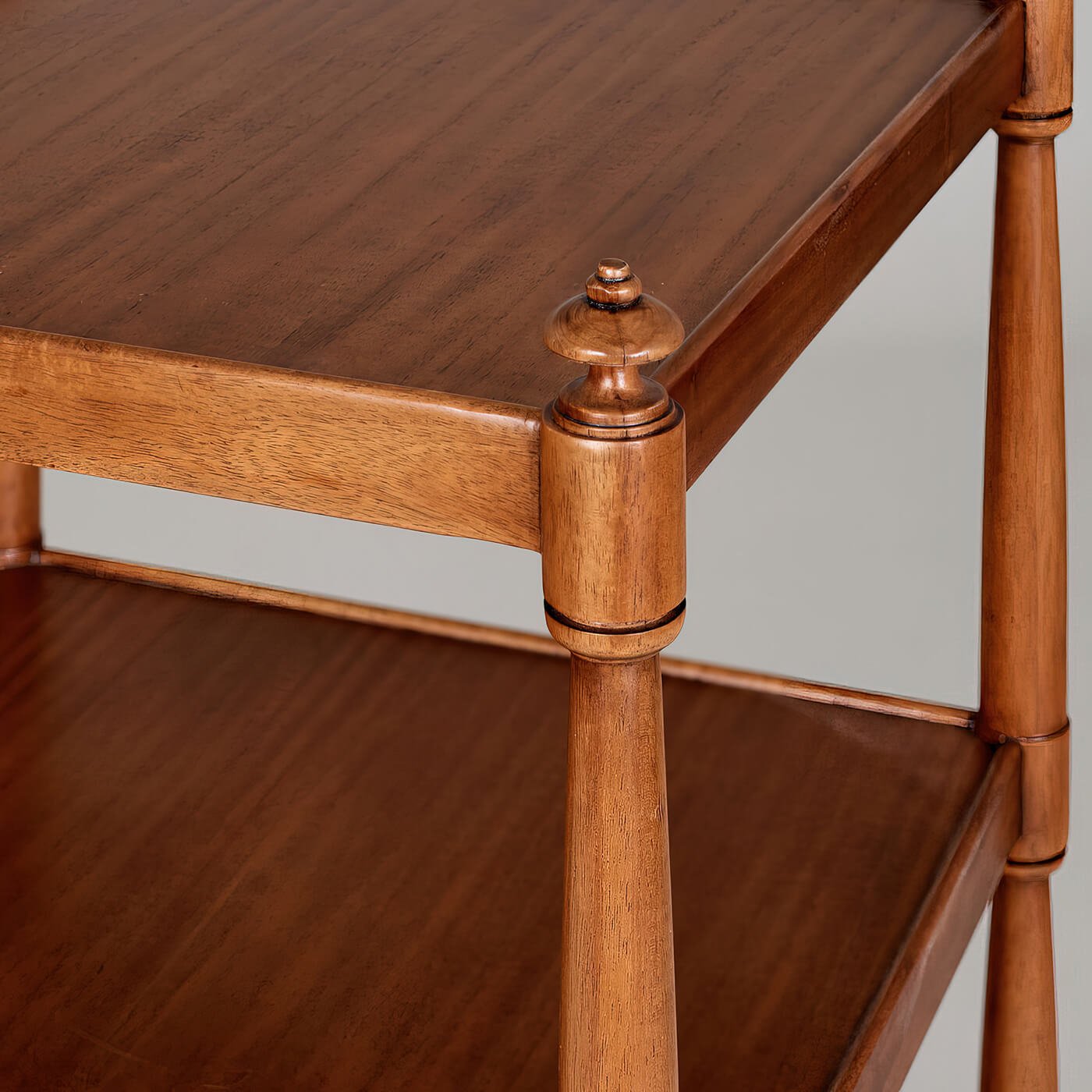 Wood finish detail of etagere corner post.