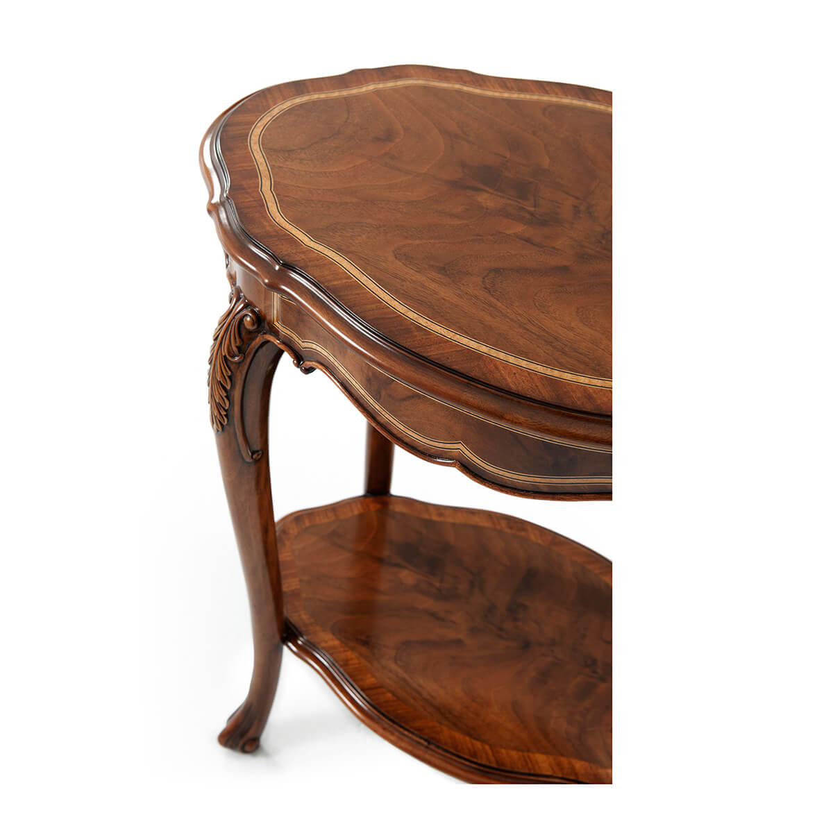 Detailed carving on English Rococo end table leg.