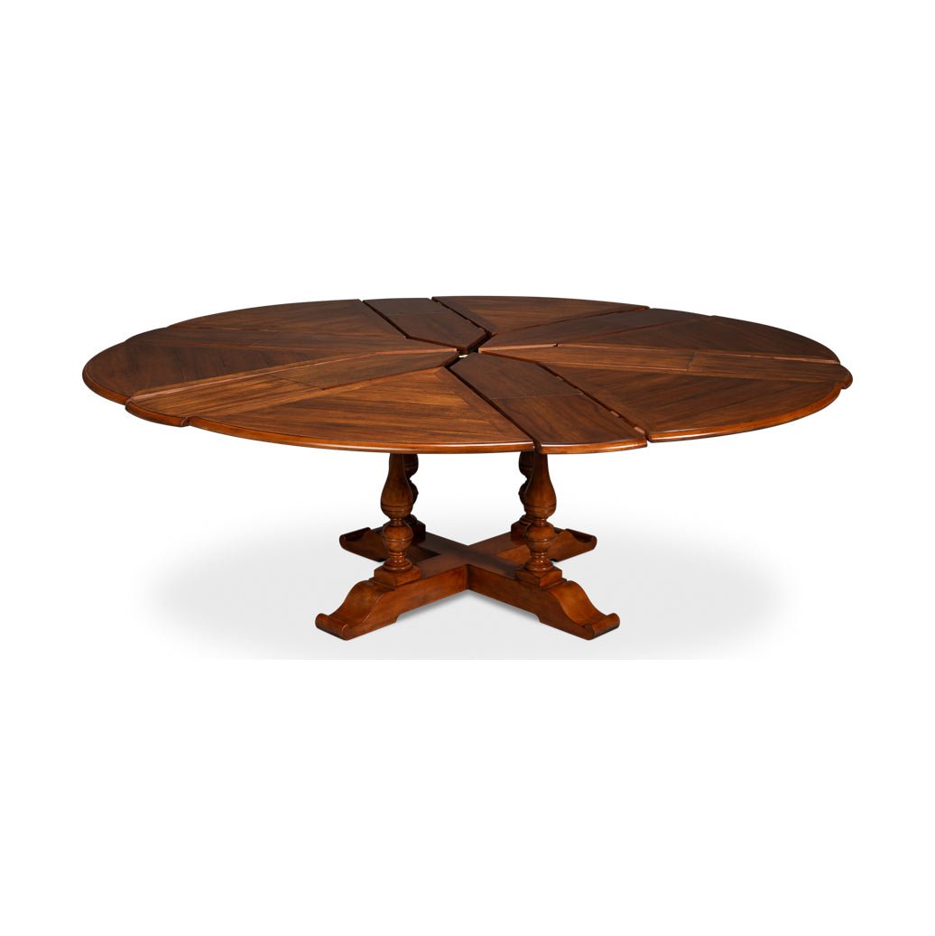 Round dining table partially extended, showing mechanism.