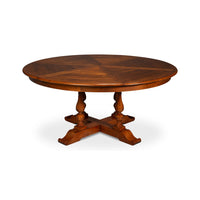 Closed round dining table, wooden design, side view.