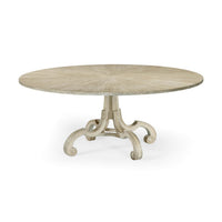Round oak dining table with curved legs, top view.