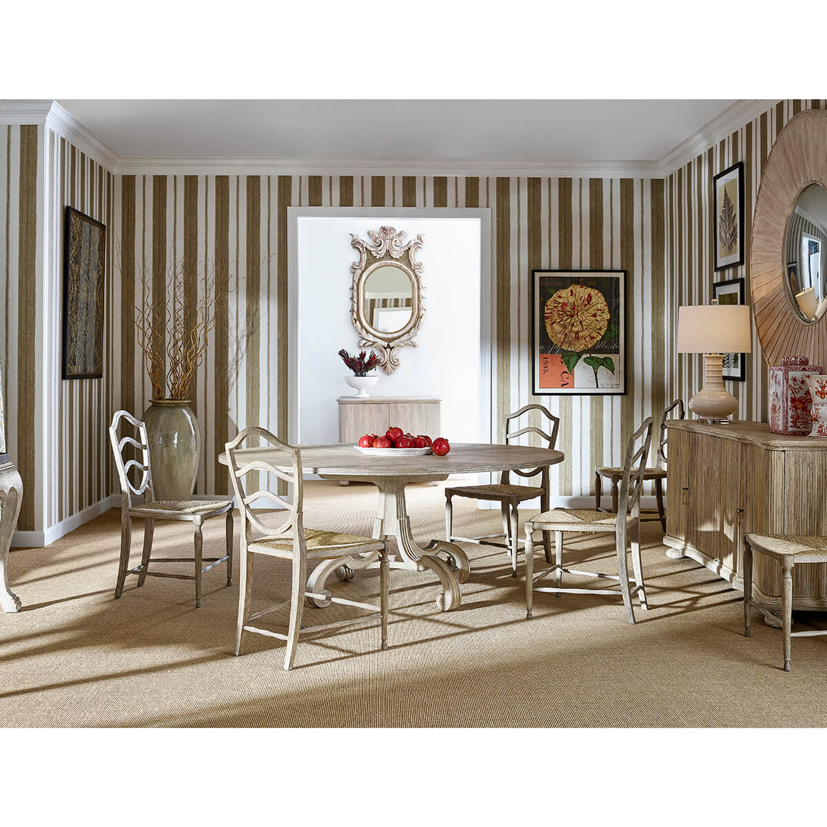 Elegant dining room setup with round oak table, striped walls.