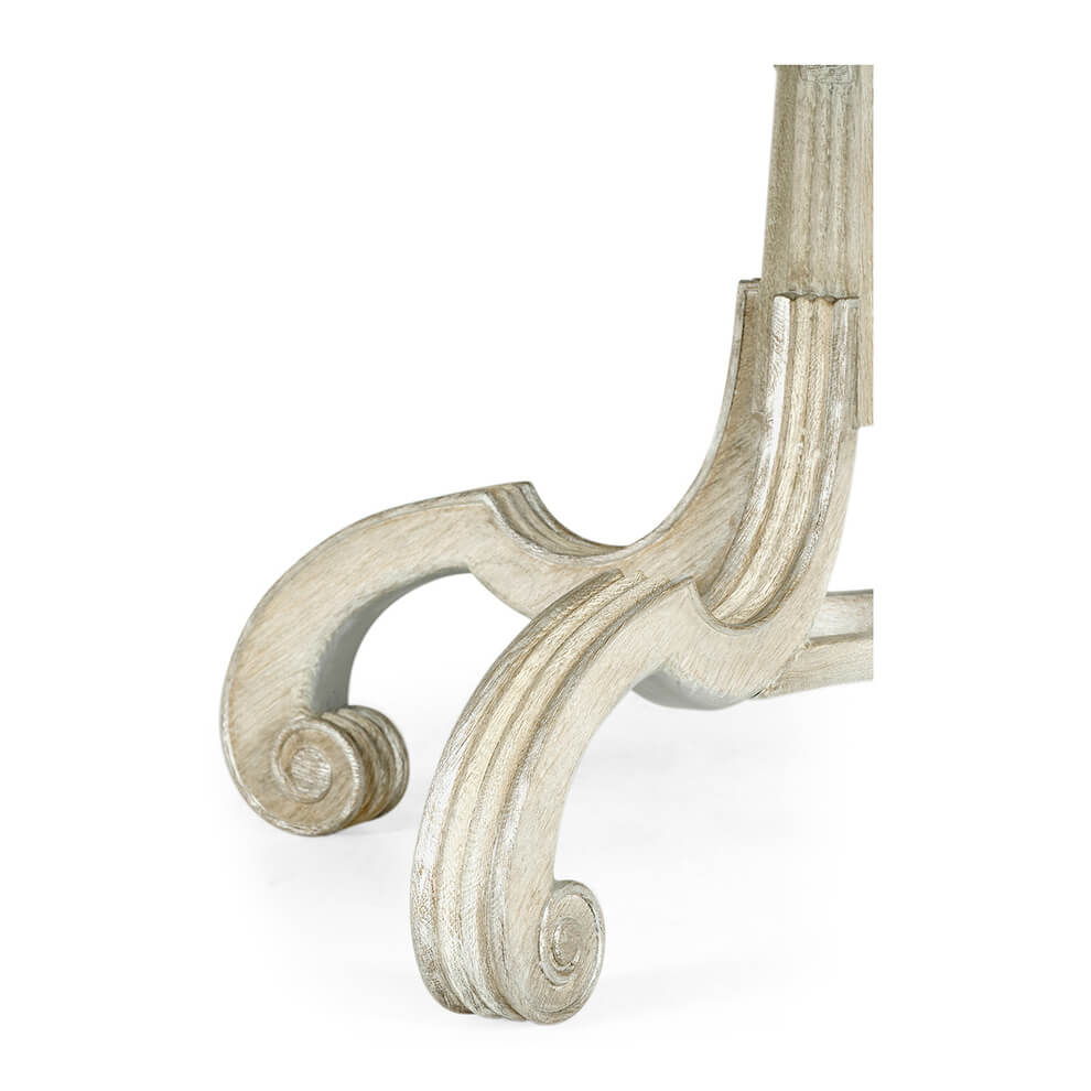 Detailed view of dining table leg, carved design.