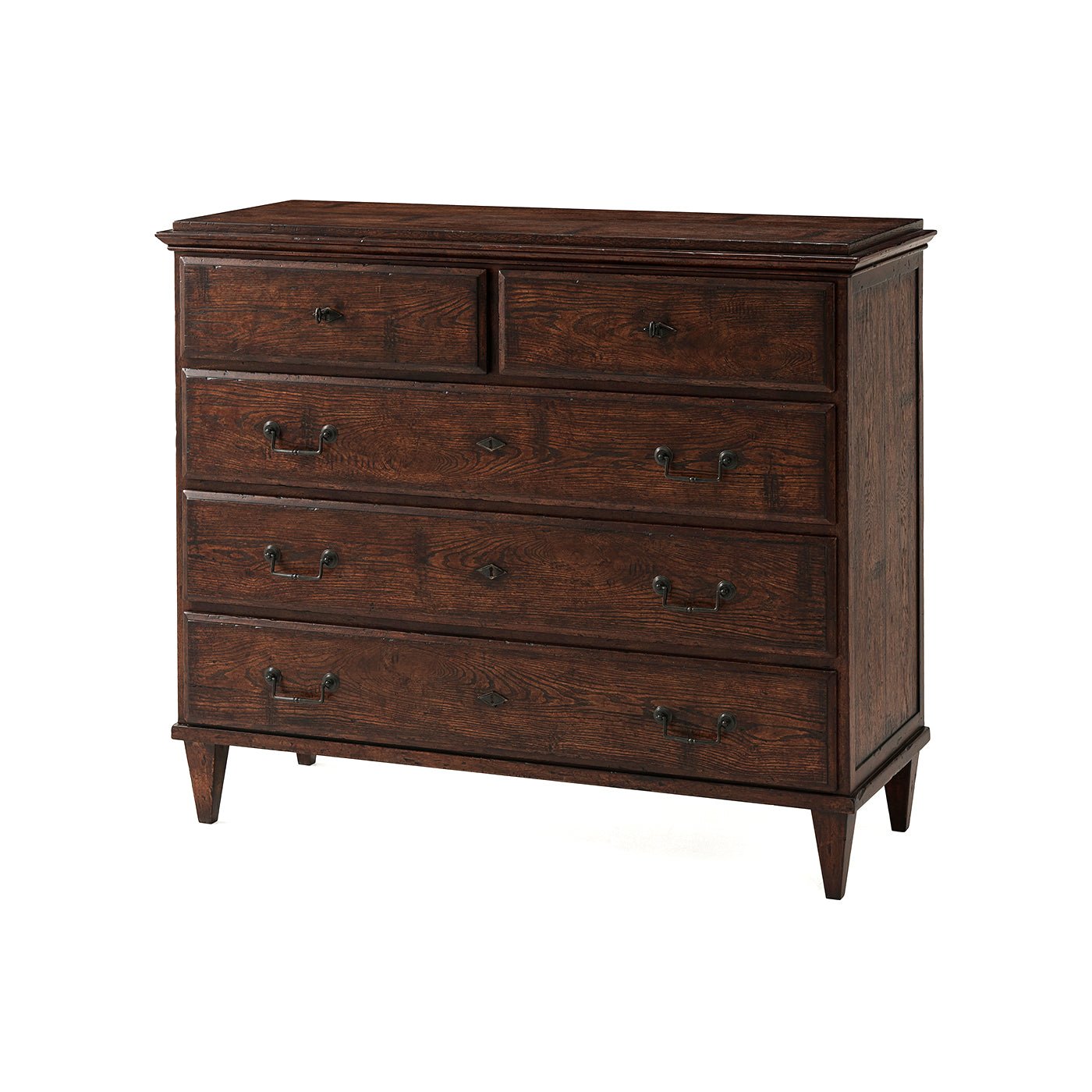 Angled view of English rustic chest of drawers.